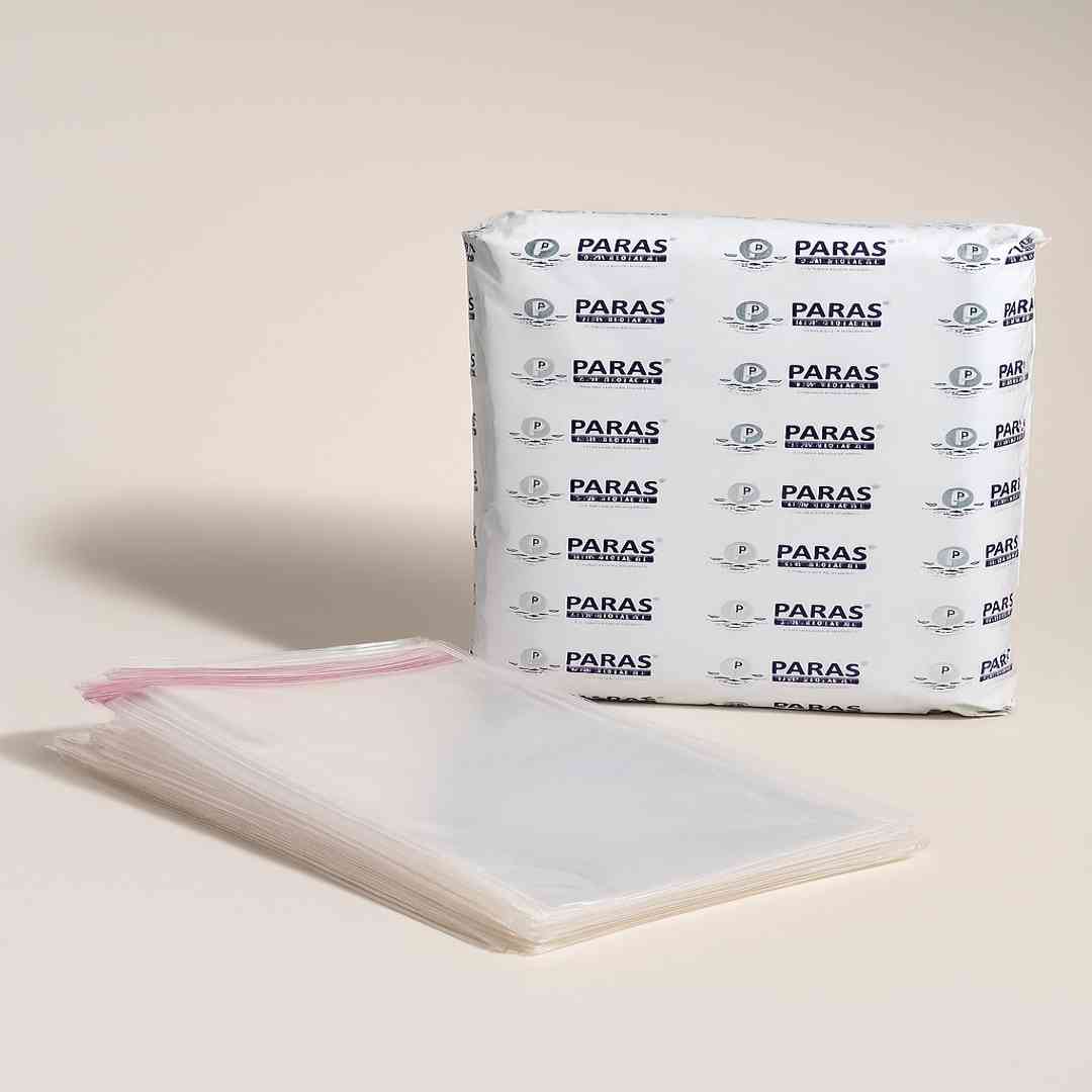 stack of transparent zipper poly bags with branded paras packing wrapper, used for garment packaging