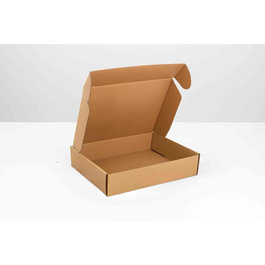 open kraft corrugated mailer box on white table used for secure ecommerce or garment product shipping
