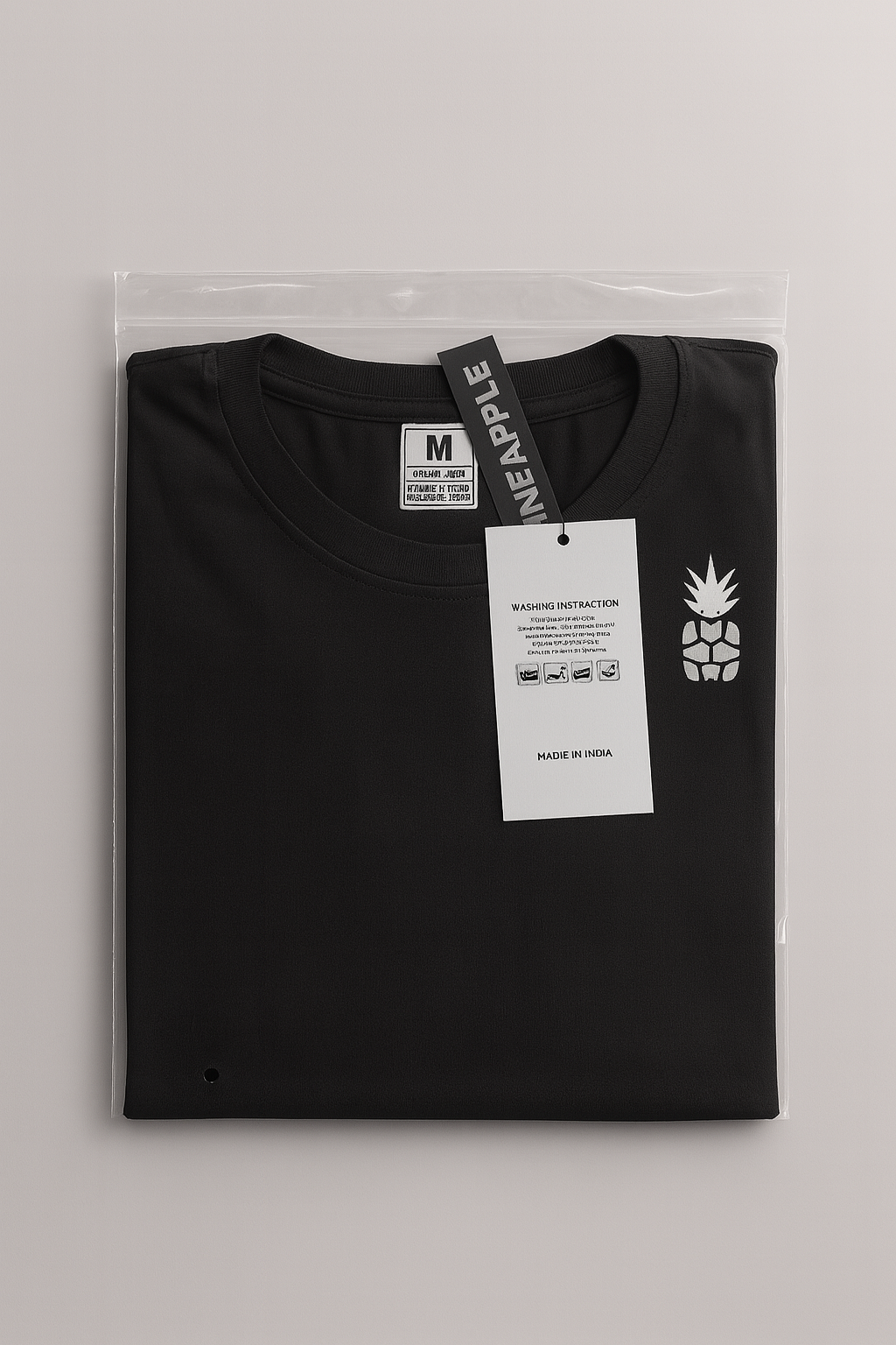 black t-shirt with brand labels on a light gray background