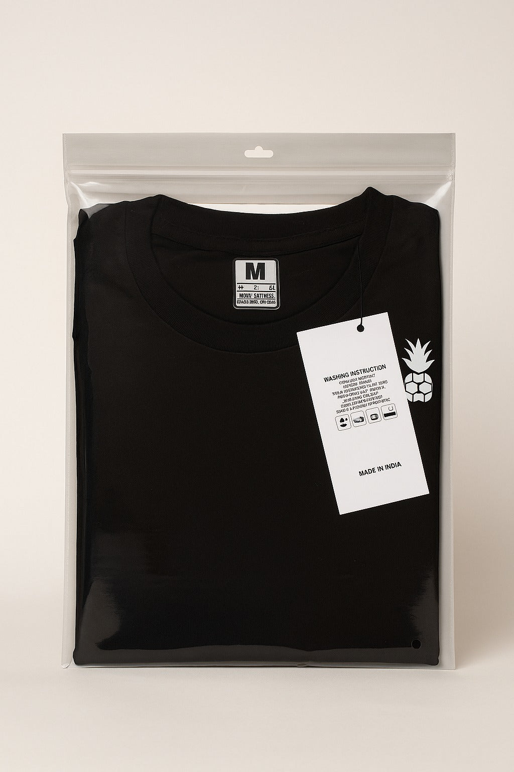 minimal clear zipper bag with black tshirt and washing label – garment packing by paras packing

