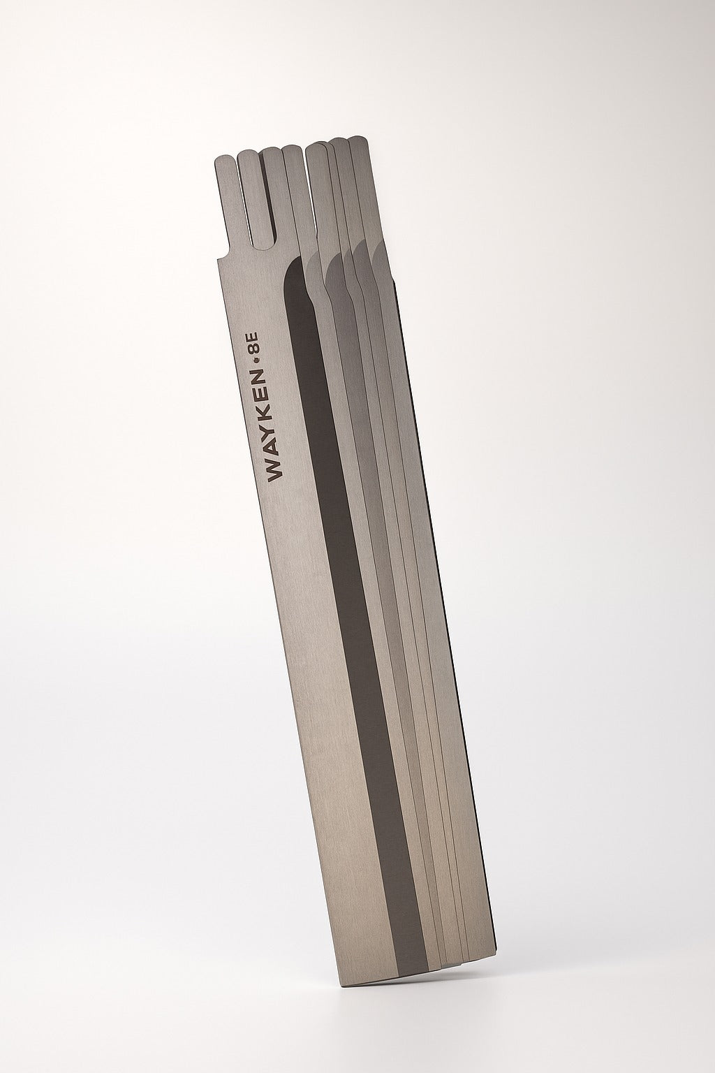 stack of wayken 8e garment cutting blades with brushed steel finish for industrial fabric machines by paras

